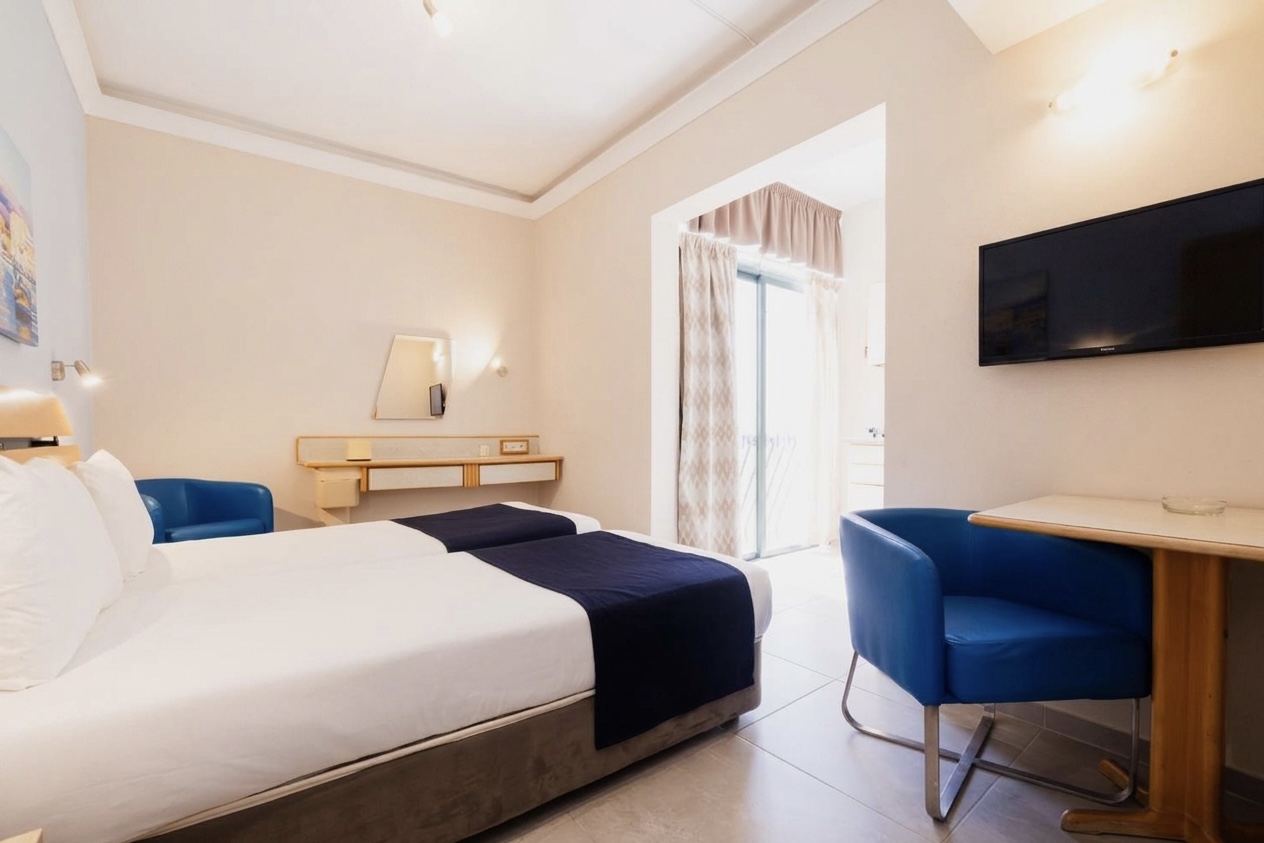 Twin room with two single beds at Xemxija Bay Hotel. Rooms and suites at an affordable rate in Malta.